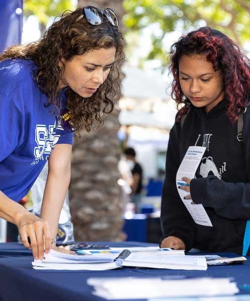 staff member helping student